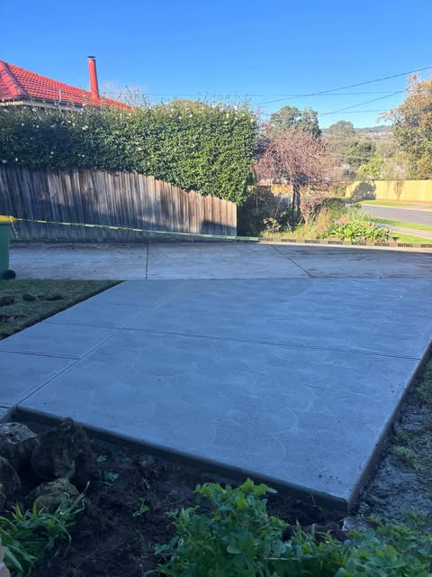 Finished broom-finish concrete patio slab