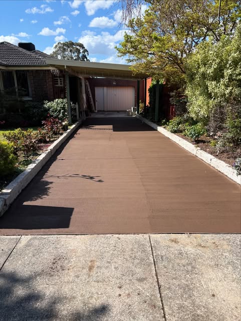 Coloured concrete driveway finished to garage
